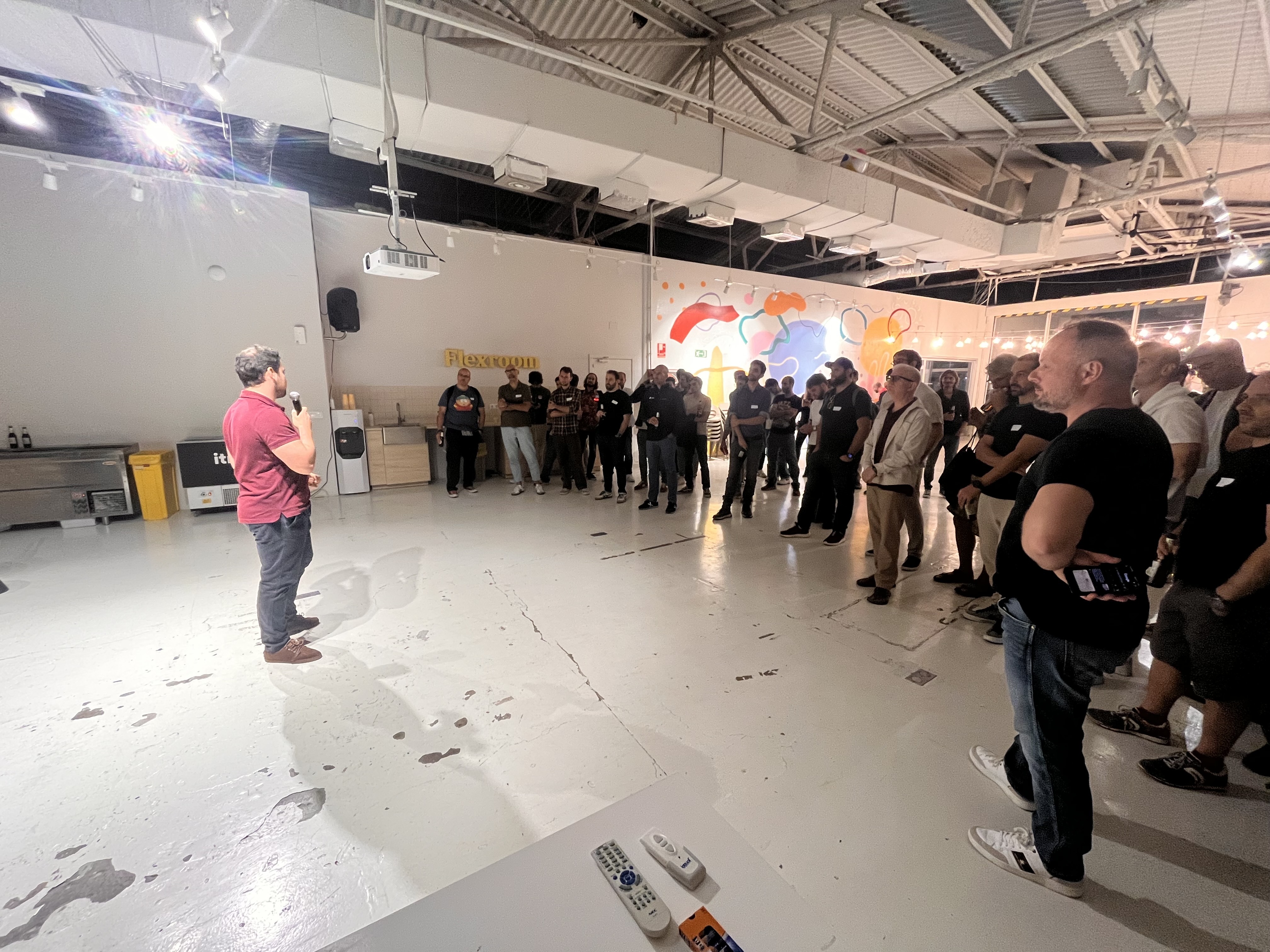 Audience listening to a CTO Circle speaker beside a shared food table